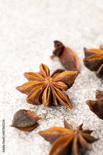 Spice star anise closeup on gray stone background