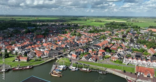 Historic city center of Makkum along the water, Friesland, The Netherlands. Aerial view.