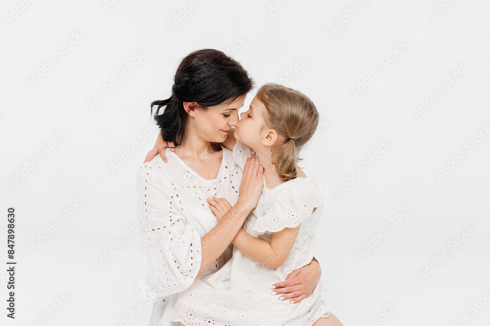 Close-up of tender touches and sensitive moment between mother and daughter. Close-up of tender touches and sensitive moment between mother and daughter.