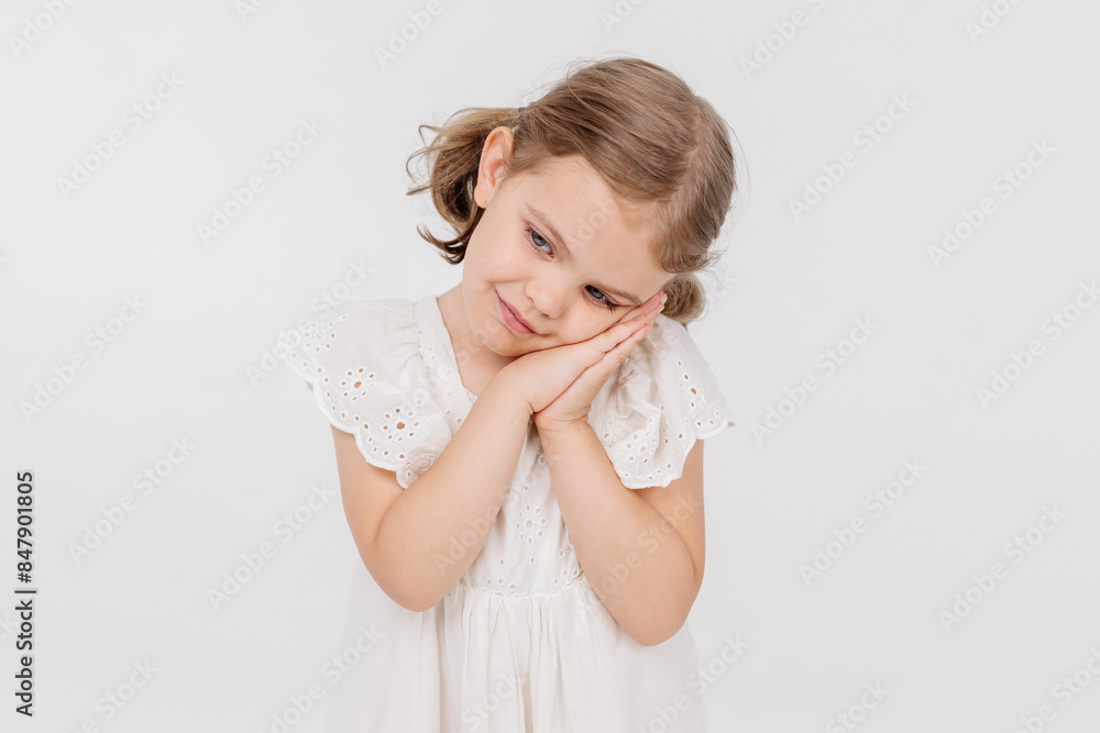 Little sensual girl on a light background. The concept of style, fashion, sensuality and carefree childhood. Little sensual girl on a light background. The concept of style, fashion, sensuality and carefree childhood.