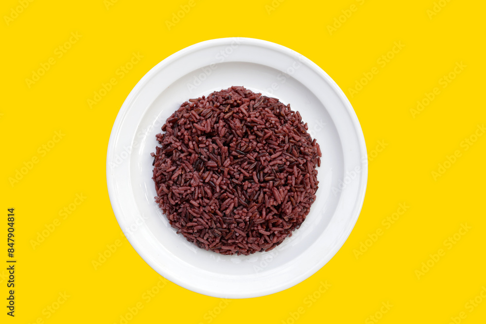 Cooked black berry rice on round plate Cooked black berry rice on round plate