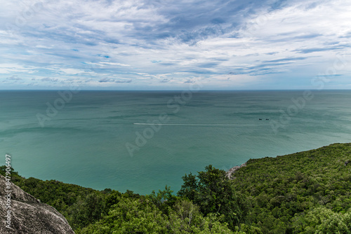 Exotic tropical viewpoint in the Thailand on coastline cliffs above clear blue ocean