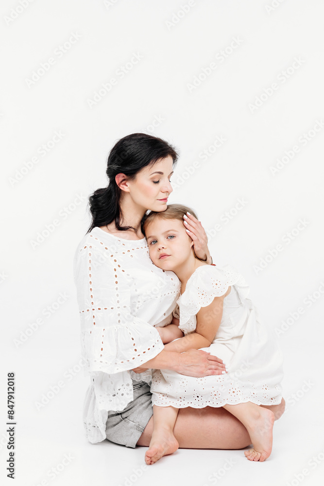 Close-up of tender touches and sensitive moment between mother and daughter. Close-up of tender touches and sensitive moment between mother and daughter.