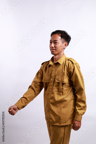 gesture of young government worker man in uniform walking isolated over white background