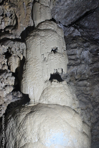 A limestone deposit that resembles a scary head. Inside a cave located in New Athos, Abkhazia. It is located under the slope of Iverskaya Mountain. This is a huge karst cavity with an area of ​​about  photo