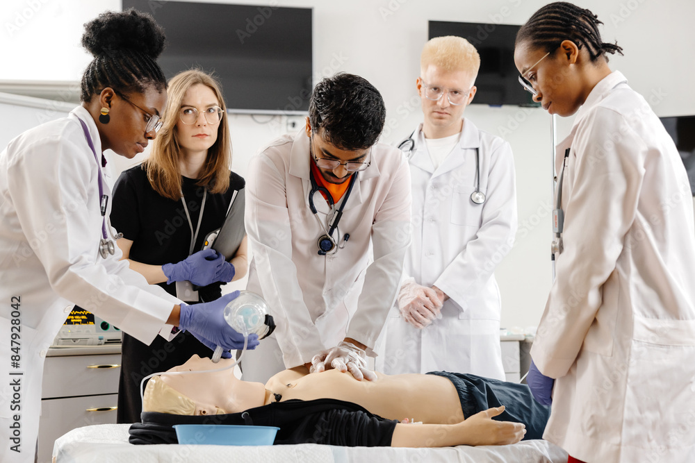 Medical Students Practicing CPR on a Dummy Medical Students Practicing CPR on a Dummy