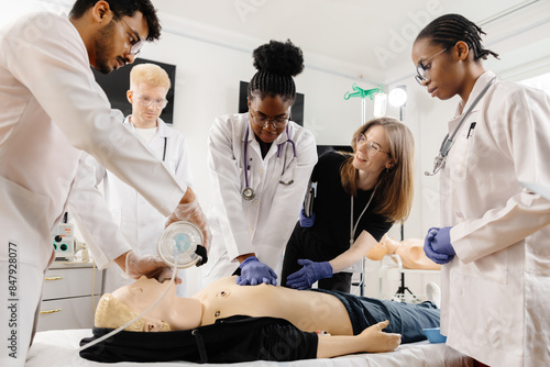 Medical Students Practice CPR on a Dummy photo