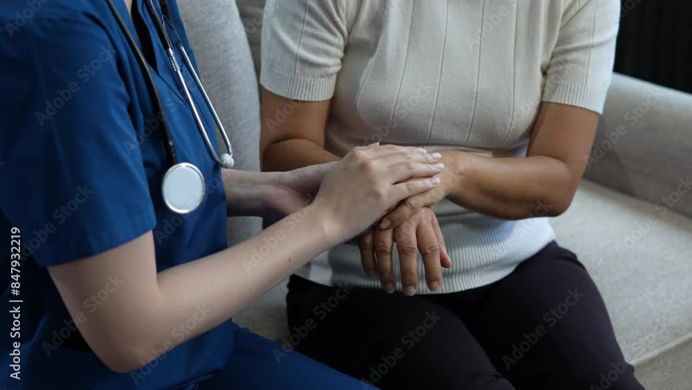 Doctor's hand reassuring elderly patient. Doctor's hand reassuring elderly patient.