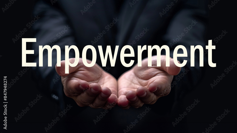 Empowerment word on the hand of a businessman. Text concept Empowerment word on the hand of a businessman. Text concept