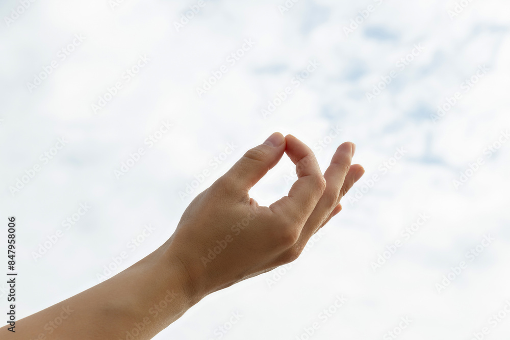 Fingers folded in zen sign on light background, close up Fingers folded in zen sign on light background, close up