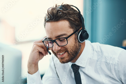 Business, man and call centre with headset listening, help desk and customer service or online advice. Tech support, sales and network with microphone for communication, agent and consultation