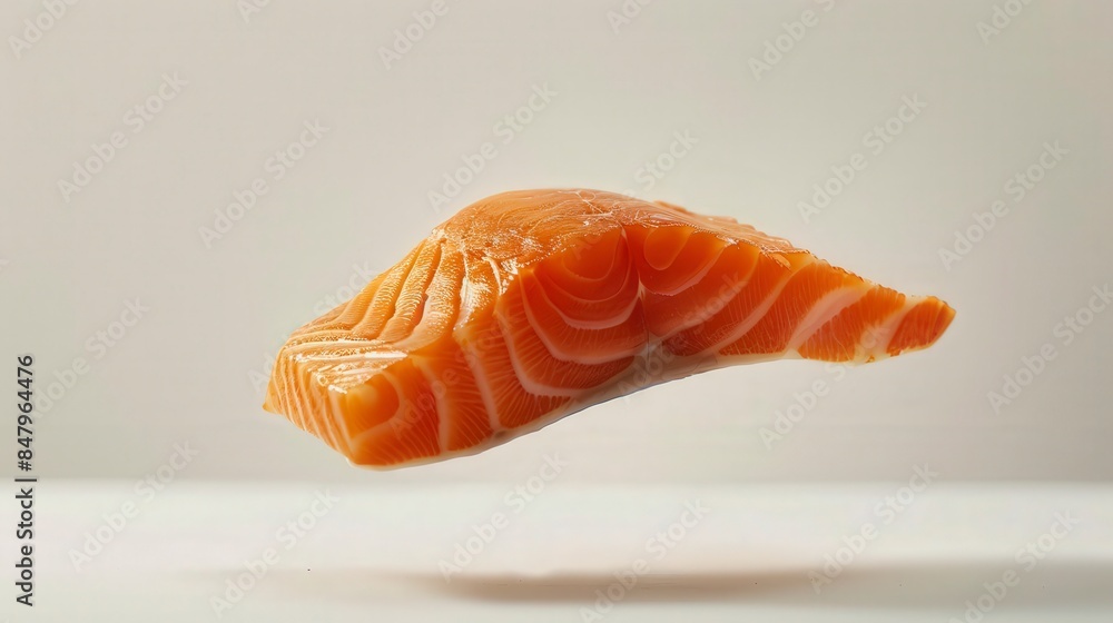 Close-up of a fresh raw salmon fillet floating against a light background, showcasing texture and freshness for seafood culinary use. Close-up of a fresh raw salmon fillet floating against a light background, showcasing texture and freshness for seafood culinary use.