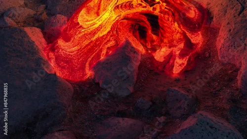 Vibrant Molten Lava Flow on Rugged Rocky Terrain