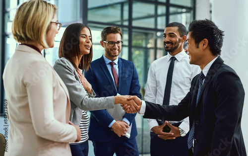 Fotografie Team, business people and shaking hands for welcome, introduction or greeting in office