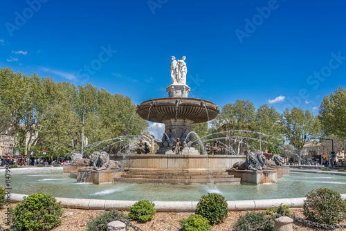 Aix-En-Provence, France - 04 20 2023: View of the Rotunda Fountain with lions and three statues symbolizing justice, agriculture and art.. photo