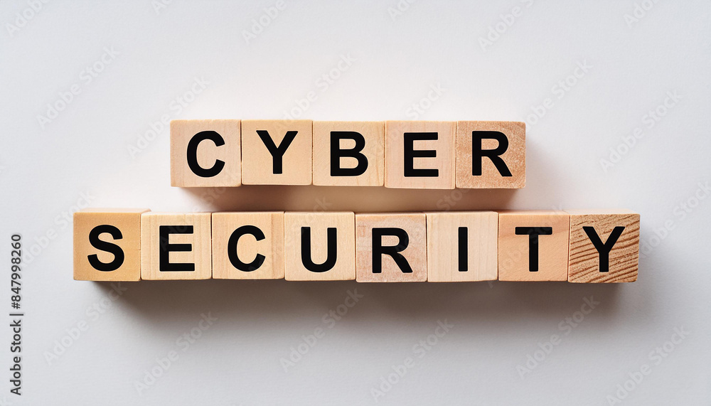 Wood blocks with text CYBER SECURITY. Protecting systems, networks, programs from digital attacks Wood blocks with text CYBER SECURITY. Protecting systems, networks, programs from digital attacks