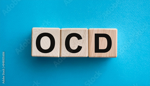 Wood blocks with abbreviation text OCD - Obsessive-Compulsive Disorder. Medicine concept. Top view photo