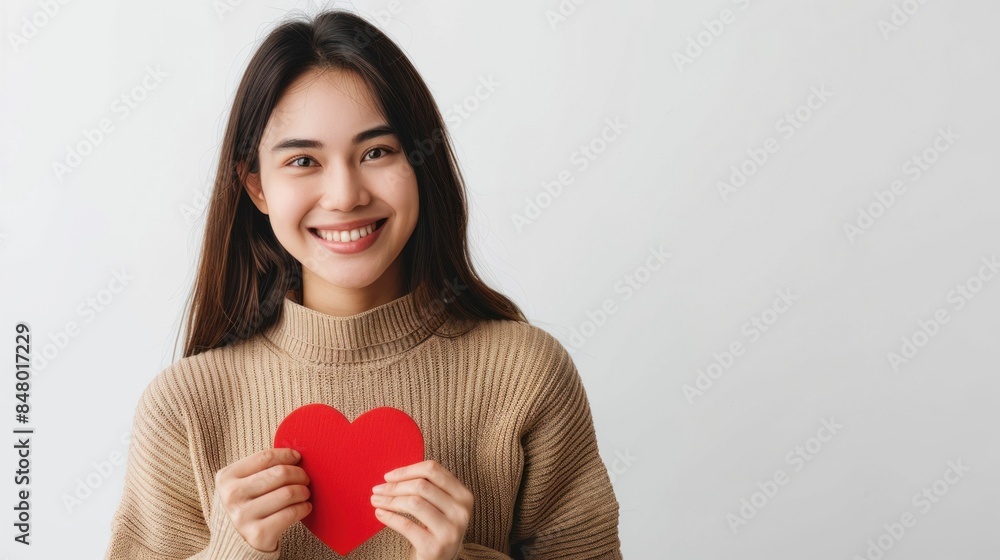 Smiling Woman Holding Red Heart Shape. Generative ai Smiling Woman Holding Red Heart Shape. Generative ai