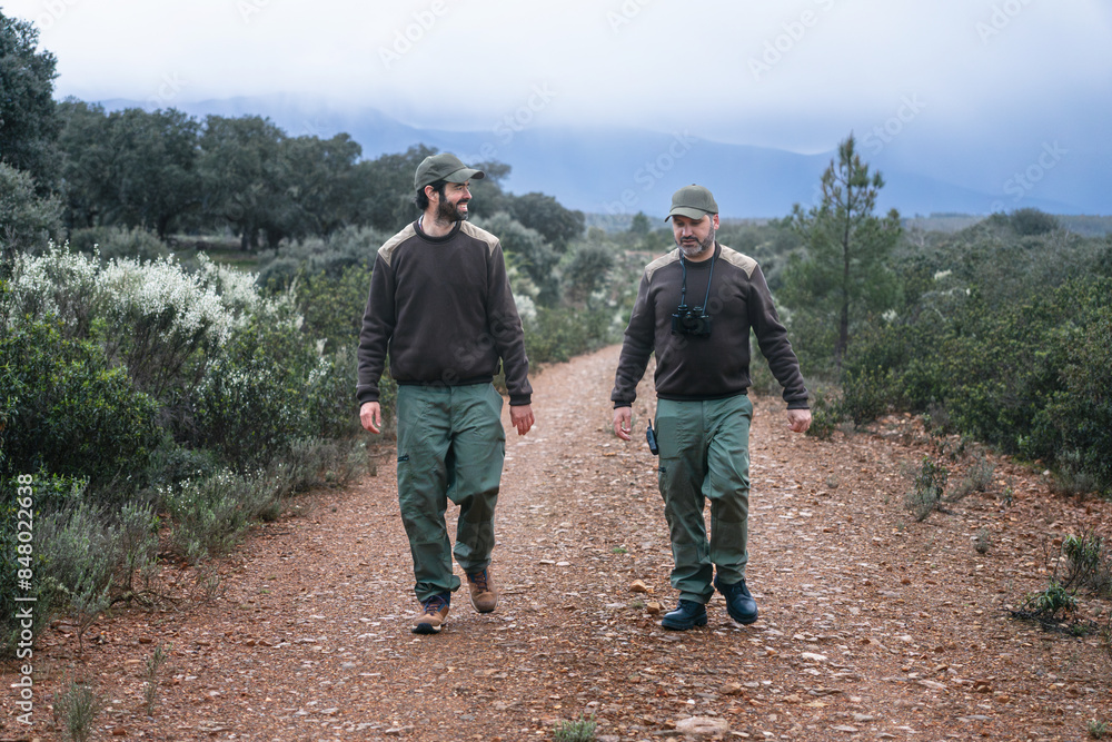 Team of two professional park ranger forest agents working on the National park Reserve in Spain Team of two professional park ranger forest agents working on the National park Reserve in Spain