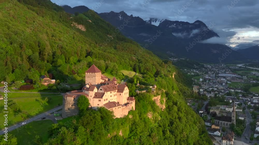 Vaduz Castle in Liechtenstein. Picturesque view of fairytale castle in Alps mountains at Sunset Time. A Landmark Aerial Vaduz Castle in Liechtenstein. Picturesque view of fairytale castle in Alps mountains at Sunset Time. A Landmark Aerial