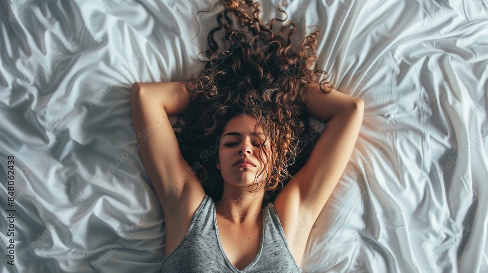 Fototapeta premium Woman lying stressed on the bed 