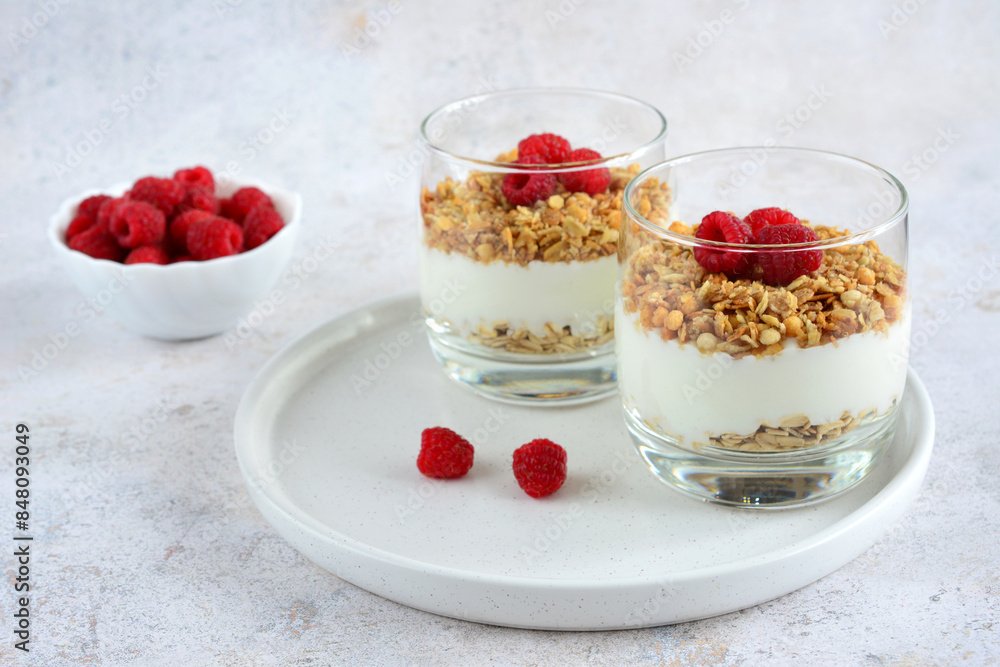 a snack of yogurt with raspberries and oat flakes a snack of yogurt with raspberries and oat flakes