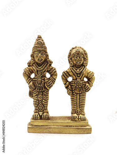 antique statue of god and goddess couple handcrafted in gold, deities of myth from hindu religion of worship isolated in a white background photo