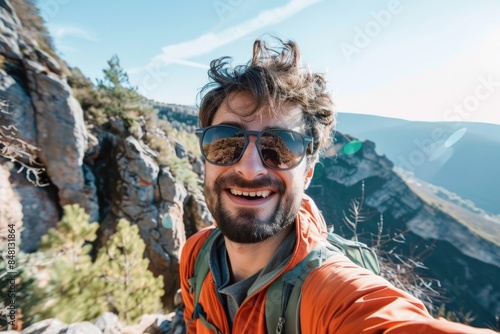 Man Sunglasses. Selfies on the Trail: Portrait of a Young Man Capturing Happy Moments while Hiking in the Mountains © AIGen