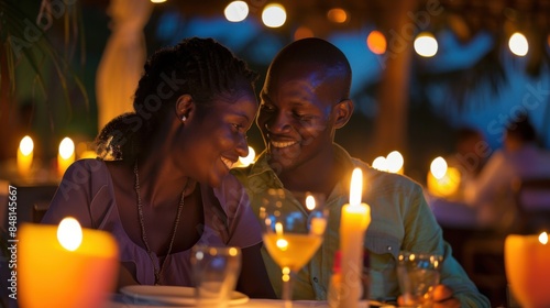 African American couple enjoying a romantic candlelit dinner at a fancy restaurant