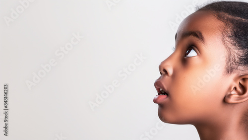 6 years old black female, surprise expression, copy space photo