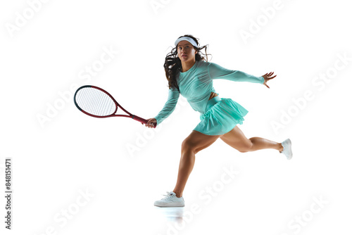 Female tennis player in mint-green outfit prepares to return shot, her expression focused against white studio background. Concept of professional sport, championship, active lifestyle, tournament. Ad