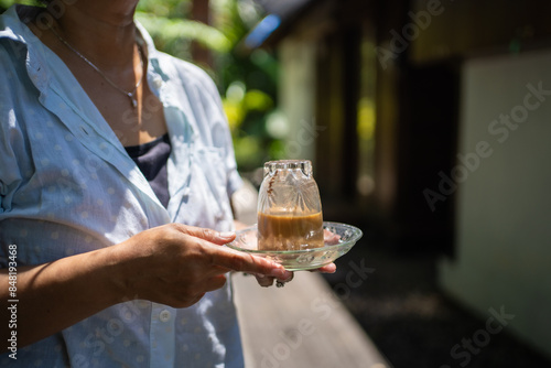 Kopi Khop, serving coffee by turning the glass upside down. Typically carried out in Aceh, Indonesia. photo