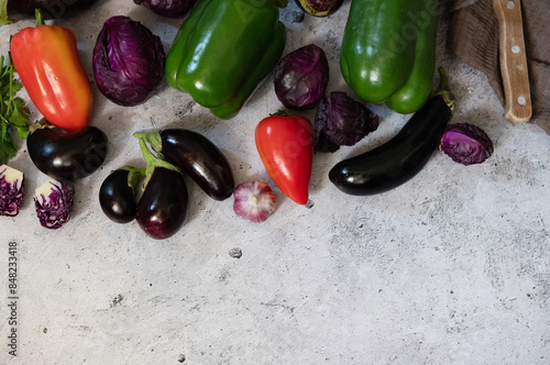 A variety of green peppers, cabbage and eggplant on the background of the old texture. Diet. Healthy eating theme background. View from above photo