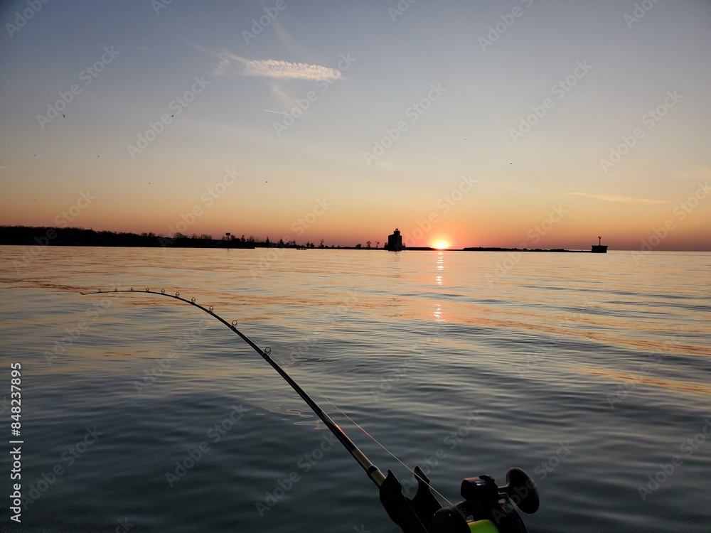 fishing with sunset over lake fishing with sunset over lake