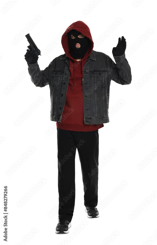 Thief in balaclava raising hands with gun on white background Thief in balaclava raising hands with gun on white background