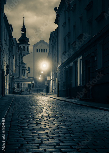 ciemna uliczka brukowana małego miasta Opole photo