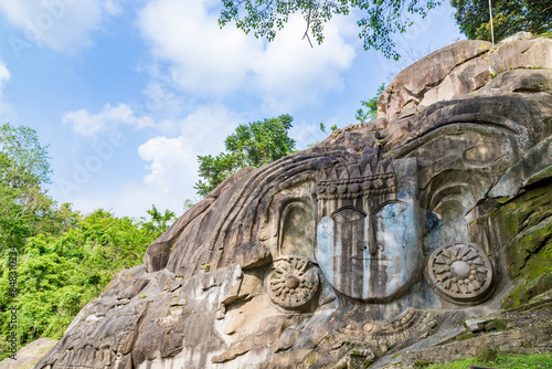 Unakoti a hindu archaeological site of bas relief structures from the ninth century. A must visit tourist destination in Tripura state of India. photo