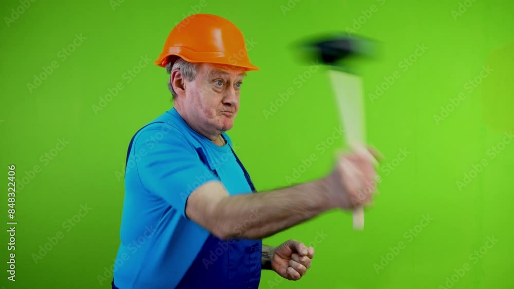 Disgruntled worker in overalls threateningly show toilet plunger, shakes fist. Disgruntled worker in overalls threateningly show toilet plunger, shakes fist.