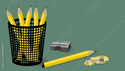 Sharpened yellow pencils in a black mesh pencil holder ready to study or work