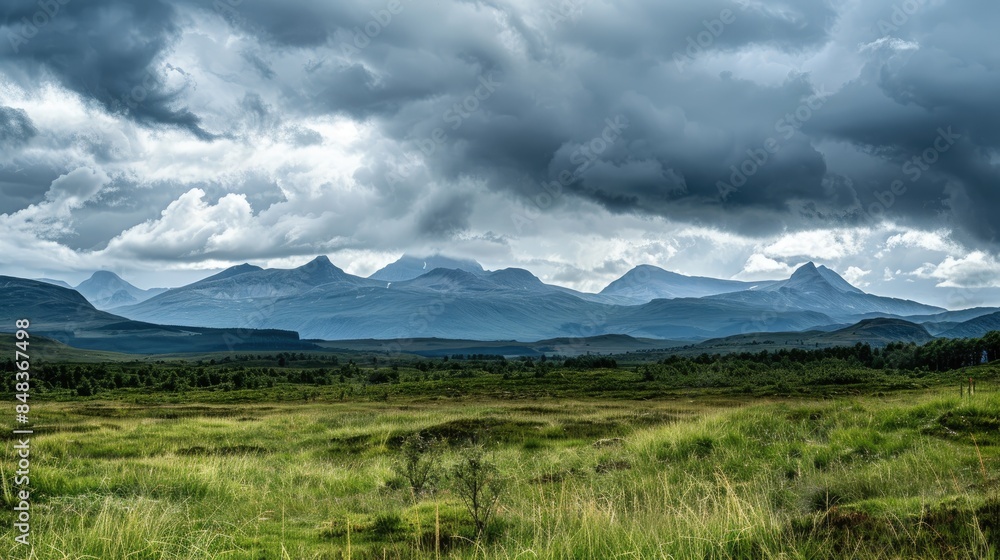 Fototapeta premium Mountains are visible in the distance amid cloudy weather