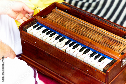Quadro su tela Unknown people playing traditional harmonium in Indian music festival or religio