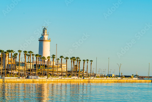 Views of the lighthouse in the port area of Malaga. Andalusia, Spain