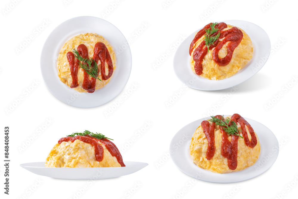 Omurice with ketchup sauce in a plate on a white isolated background Omurice with ketchup sauce in a plate on a white isolated background