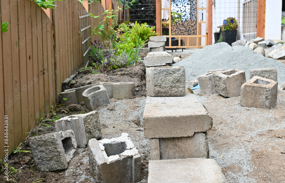 Yard and garden project in progress, bricks and rocks for terracing ...