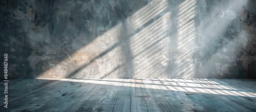 A black and white photo of a room with a window and a shadow on the wall. The room is empty and the light is coming in through the window, creating a sense of emptiness and solitude