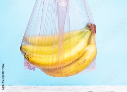 Bananas in a transparent grocery bag, ripe bananas in a plastic bag