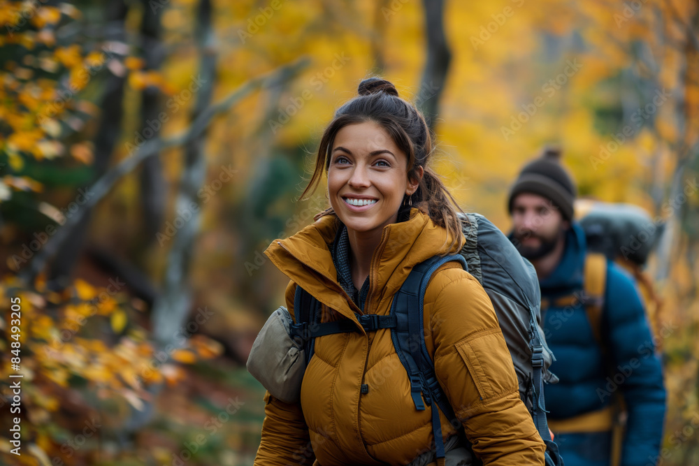 Happy hikers exploring a vibrant autumn forest. Two friends enjoying a hike through fall foliage, signifying adventure, nature, and outdoor activity. Ideal for travel and lifestyle content. Happy hikers exploring a vibrant autumn forest. Two friends enjoying a hike through fall foliage, signifying adventure, nature, and outdoor activity. Ideal for travel and lifestyle content.