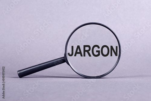 Canvas-taulu A magnifying glass hovering above the word jargon, highlighting the intricate details of the text
