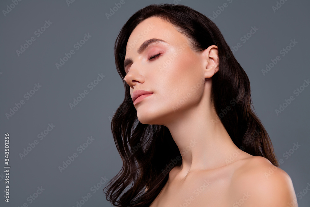 Photo of curly brunette haired girl close eyes beauty concept isolated grey color background Photo of curly brunette haired girl close eyes beauty concept isolated grey color background