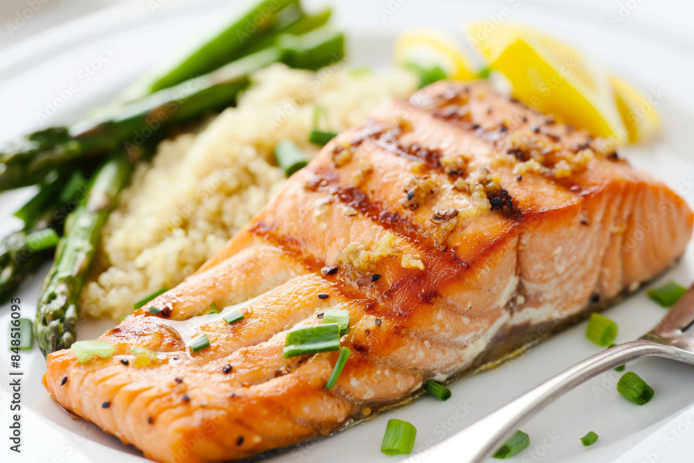 Grilled salmon with asparagus, quinoa, and lemon slices is a healthy meal for lunch or dinner. Ideal for promoting balanced nutrition and delicious healthy eating. Healthy eating Grilled salmon with asparagus, quinoa, and lemon slices is a healthy meal for lunch or dinner. Ideal for promoting balanced nutrition and delicious healthy eating. Healthy eating